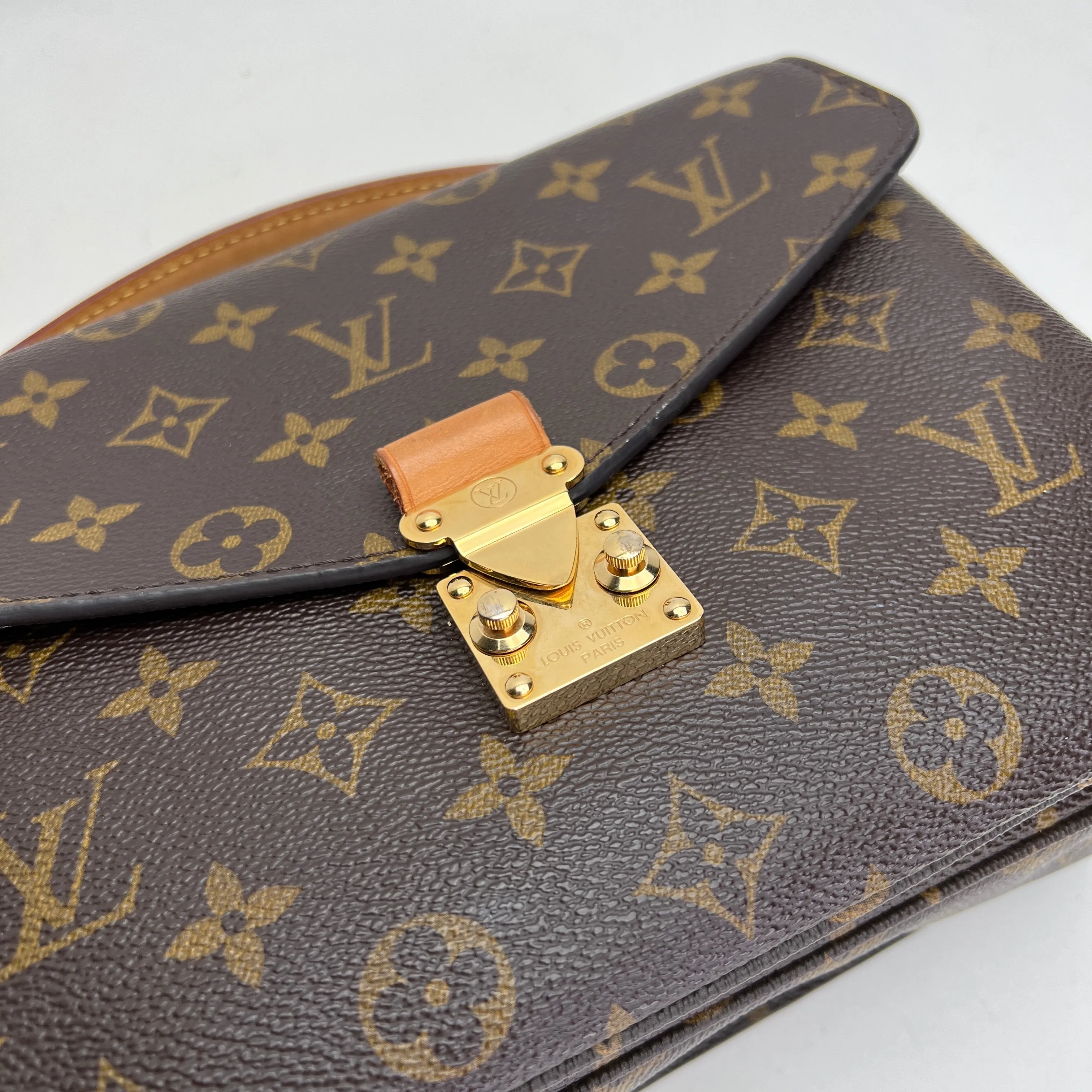 Metis Pochette Brown Crossbody Bag in Monogram Coated Canvas, Gold hardware