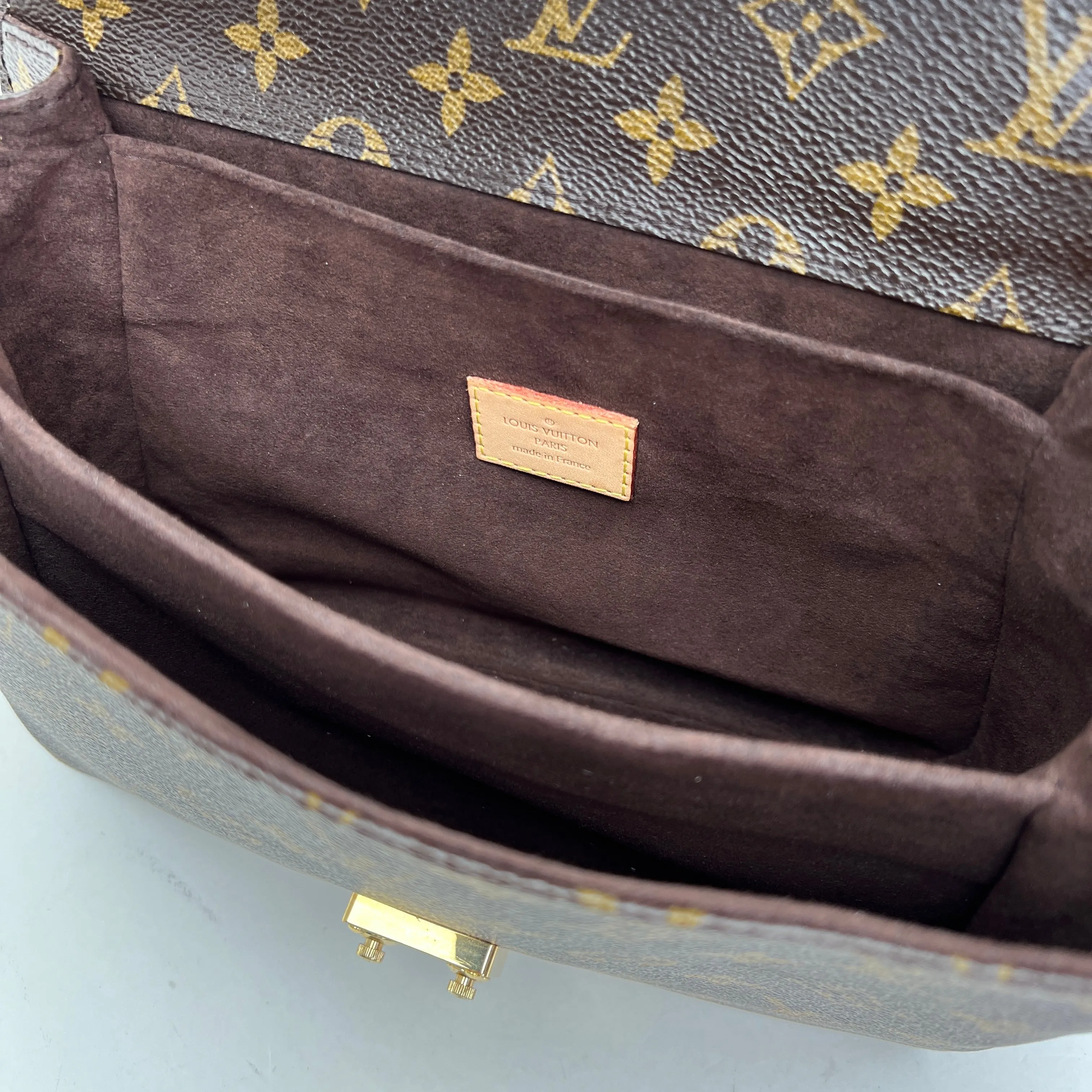 Metis Pochette Brown Crossbody Bag in Monogram Coated Canvas, Gold hardware